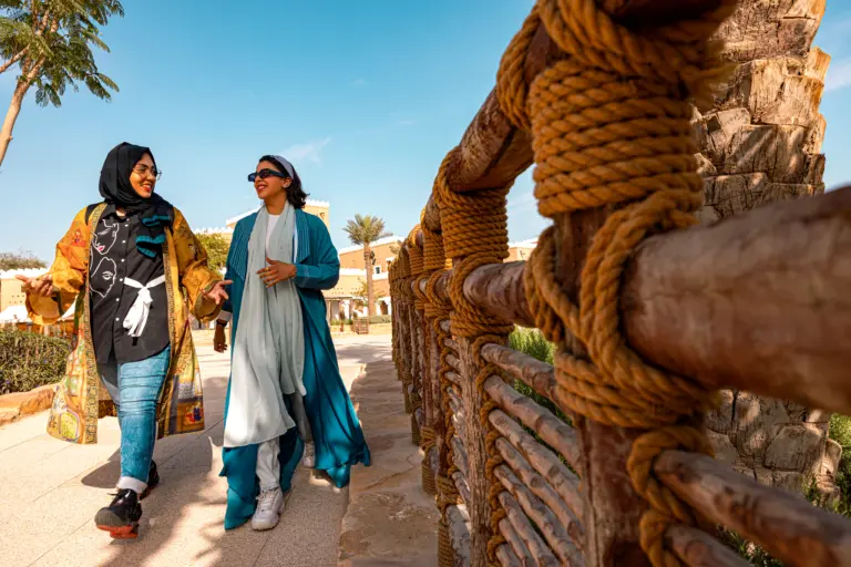 Two women walking on a Bujairi Terrace in Diriyah