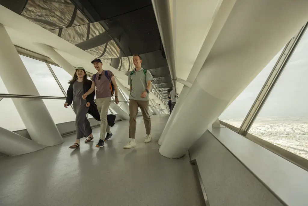 Tourists walking in a corridors of an ultra-modern building