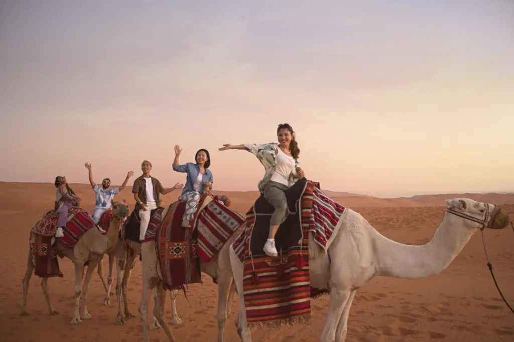 A group of people on a camel ride