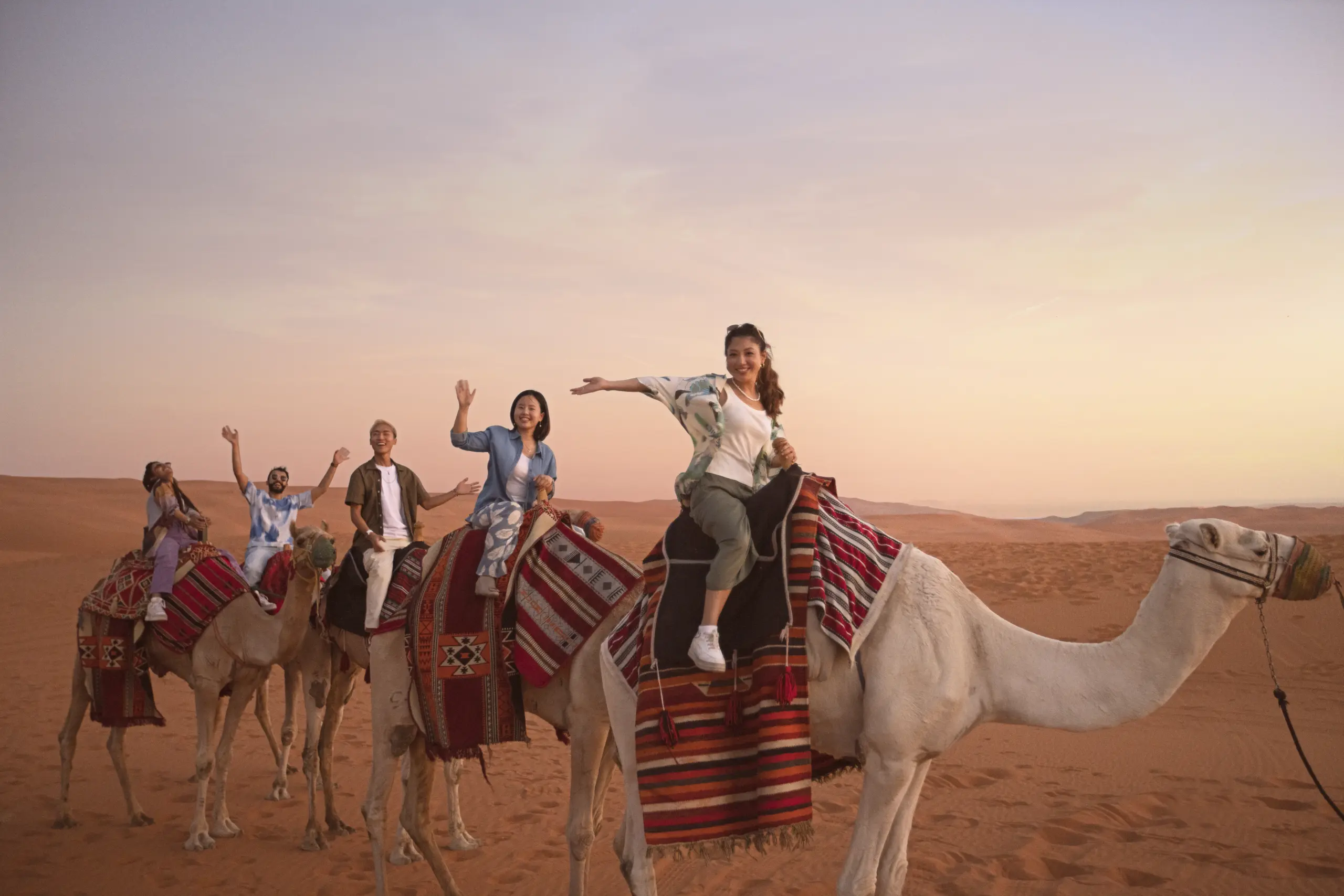 A group of people on a camel ride