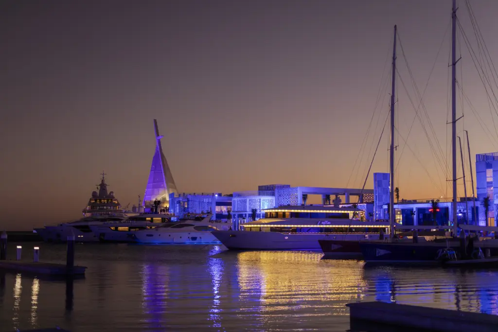 Yachts docked at the Jeddah Yacht Club at twilight