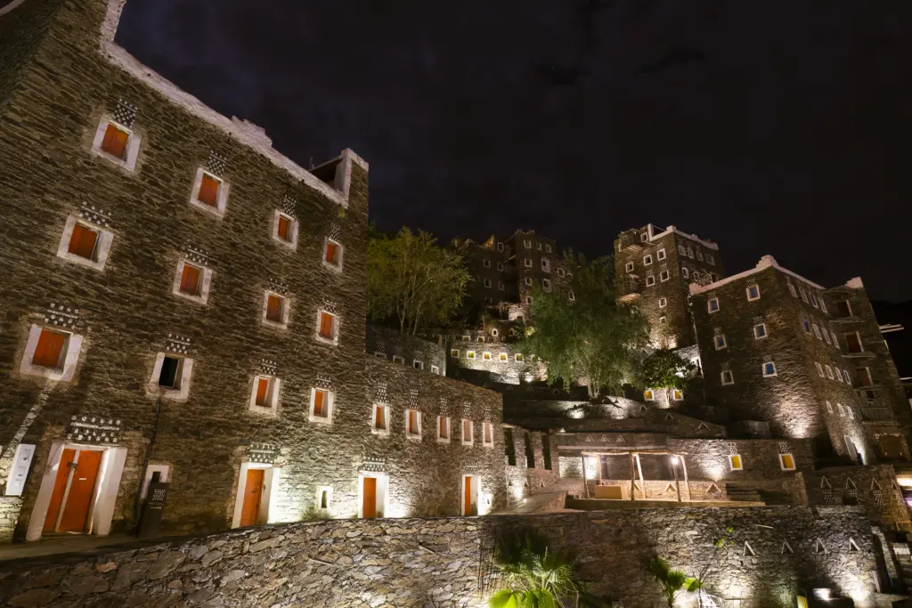 An evening view of the exterior walls of the Rijal Almaa Heritag